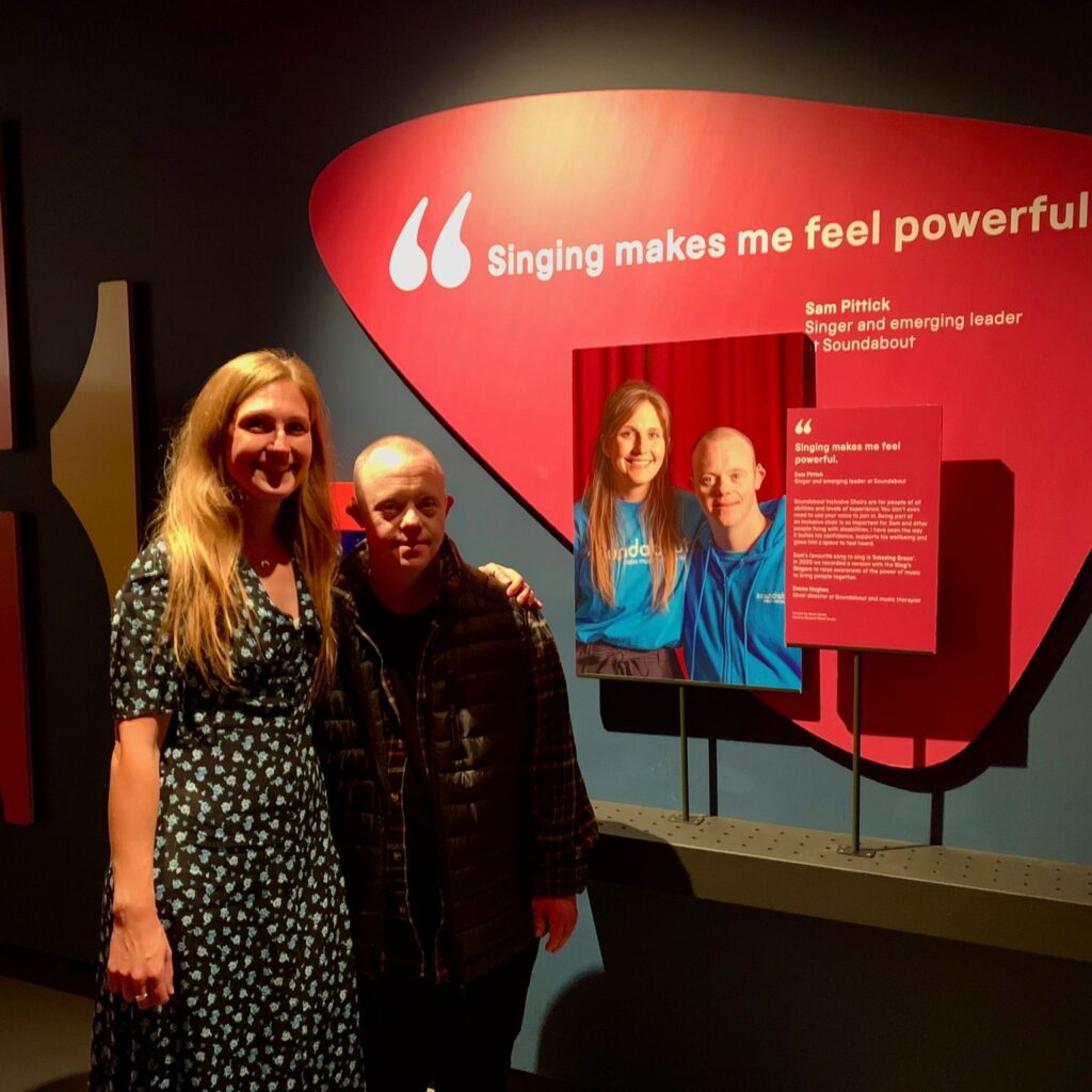 Photo of Emma and Sam in front to the Museum display